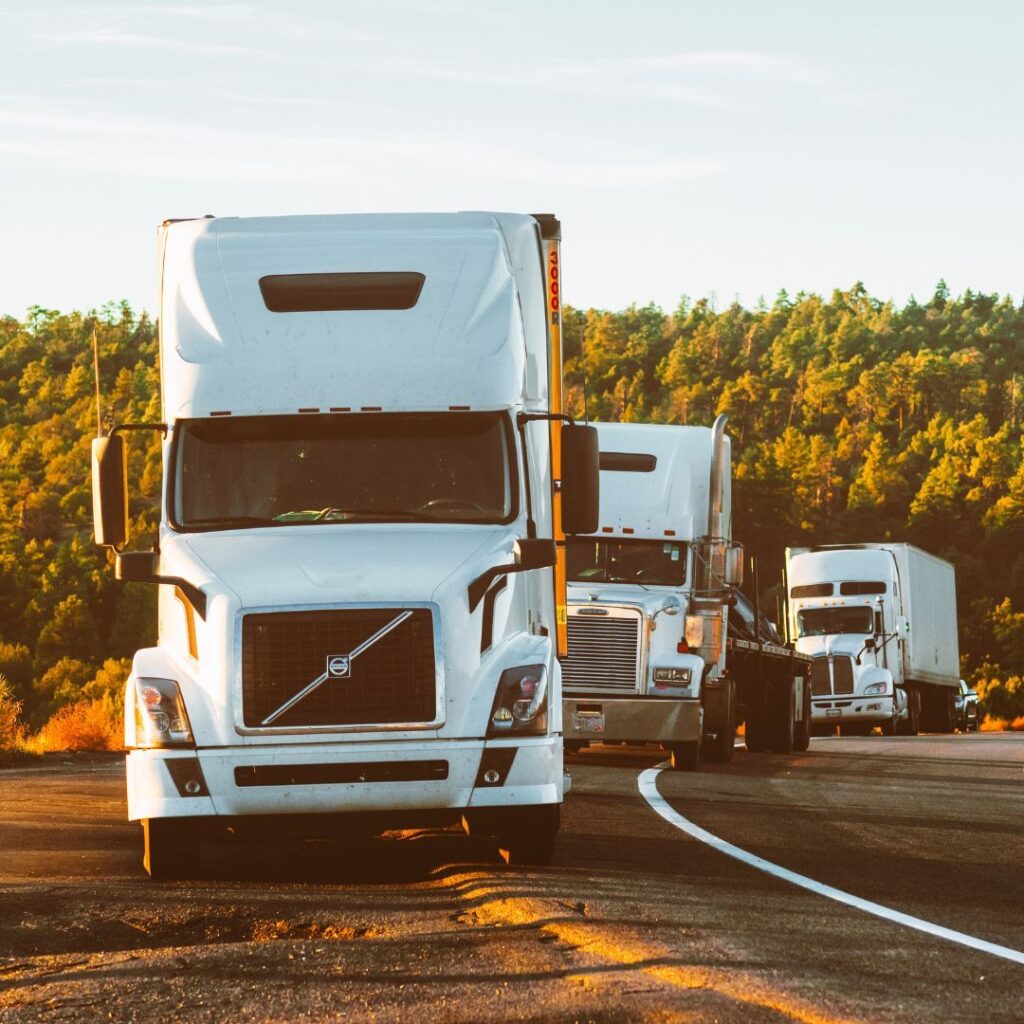 trucks driving down street